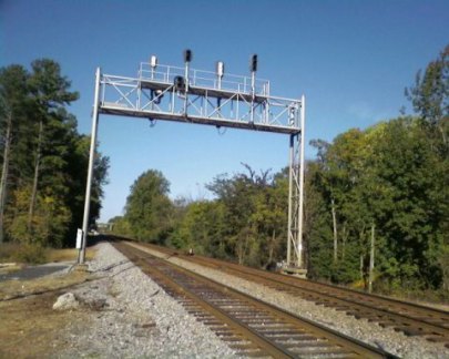 (6) The rail line crossing at Old Atlanta Hwy & Lanier Ave.